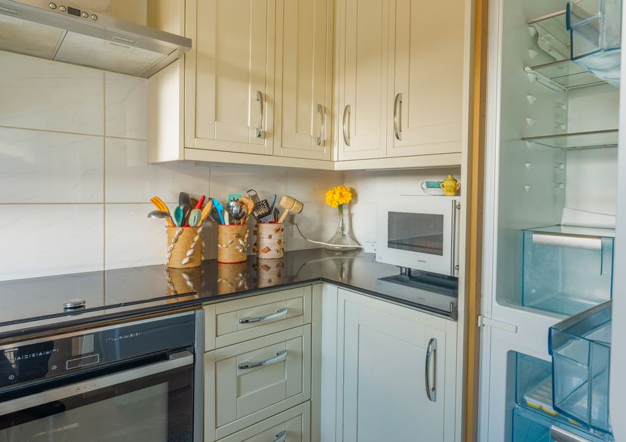 Cream kitchen with an oven and fridge
